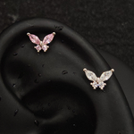 Titanium butterfly marquise CZ piercing studs in pink and white worn on ear cartilage helix, silver tone flat-back labret with marquise wing and round body CZ stones
